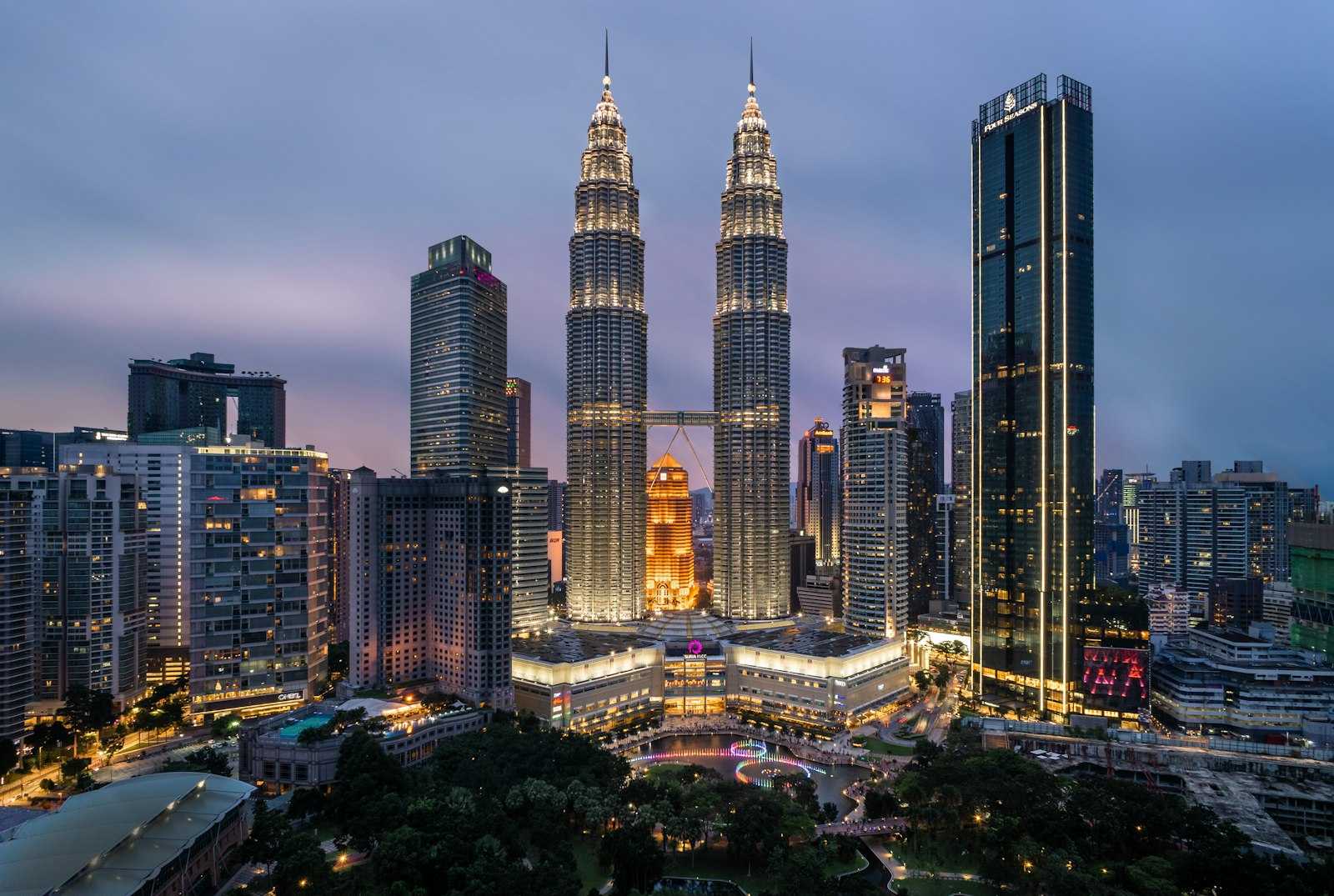 Petronas Twin Towers and Kuala Lumpur skyline at dusk, Malaysia